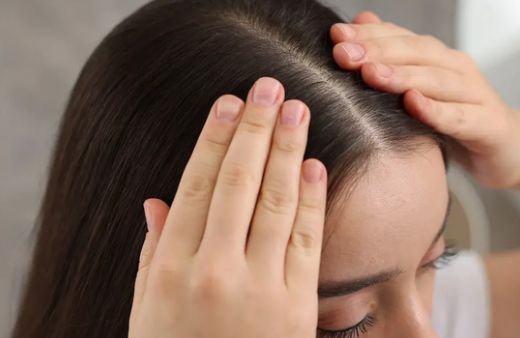 Scalp examination for thinning hair at the crown